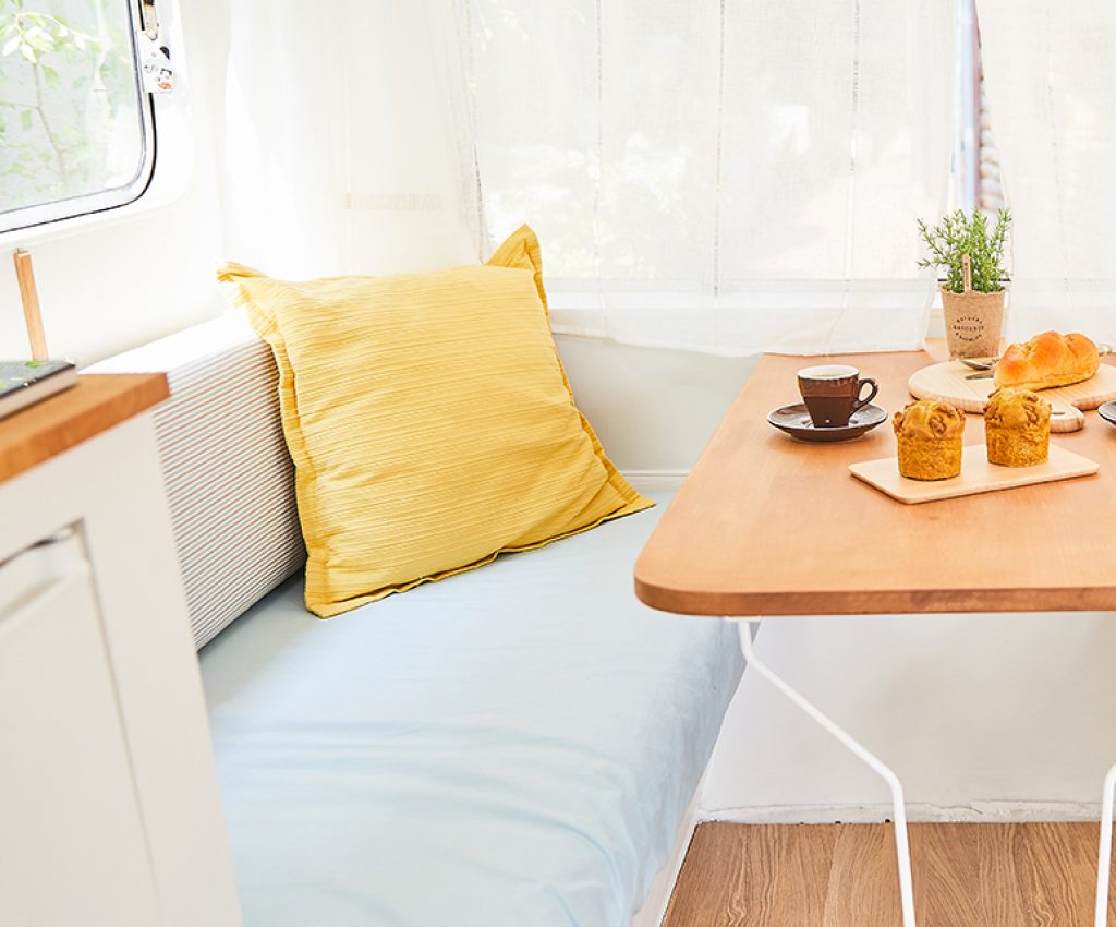 sofa and table in vintage caravan(retro design camper); Shutterstock ID 775122169; Purchase Order: -