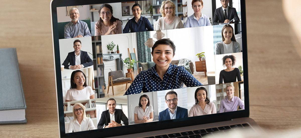 Back view of female employee speak talk on video call with diverse multiracial colleagues on online briefing, woman worker have Webcam group conference with coworkers on modern laptop at home; Shutterstock ID 1689338029; Purchase Order: -